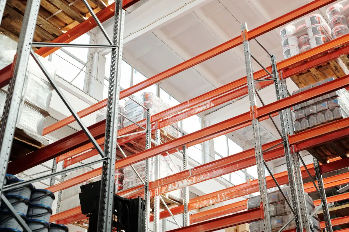Warehouse pallet racking stocked with stored goods
